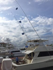 4 white marlin flags at the dock